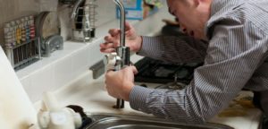 guy repairing at the sink